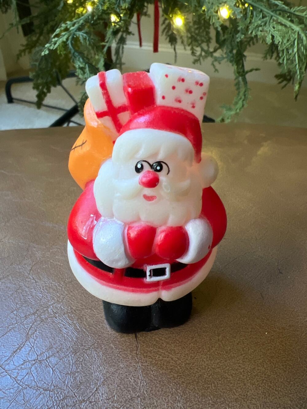 This item is a vintage 1991 Santa Claus rubber figurine.